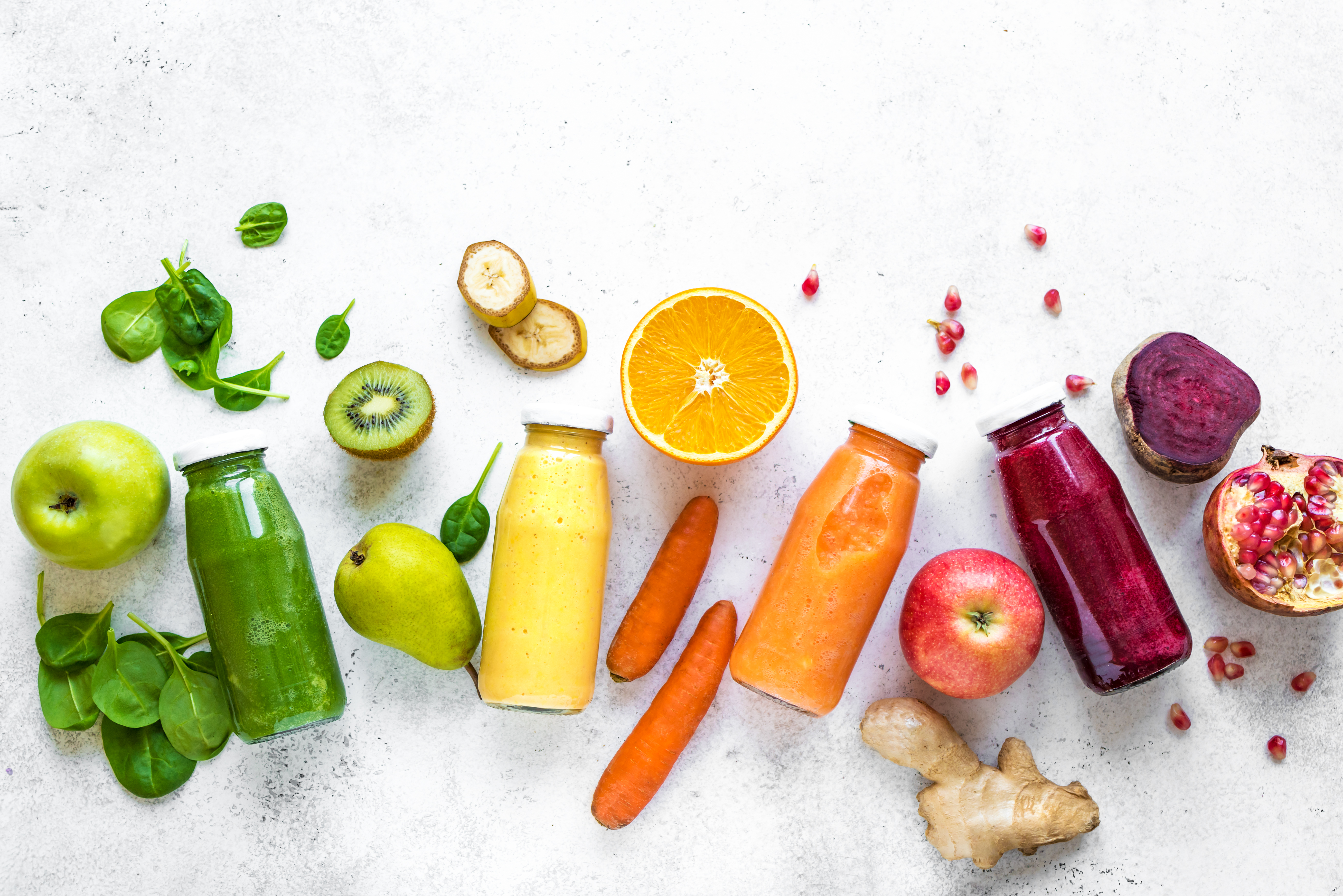 colorful bottles of fruit and vegetable juices